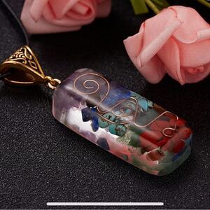 Pretty Chakra pendant necklace. 12”long with stones and bronze detail. Unisex
